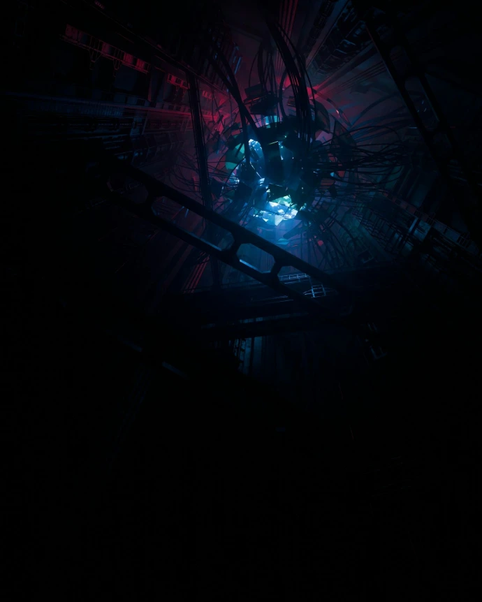 A dark room with a blue and red light in it
